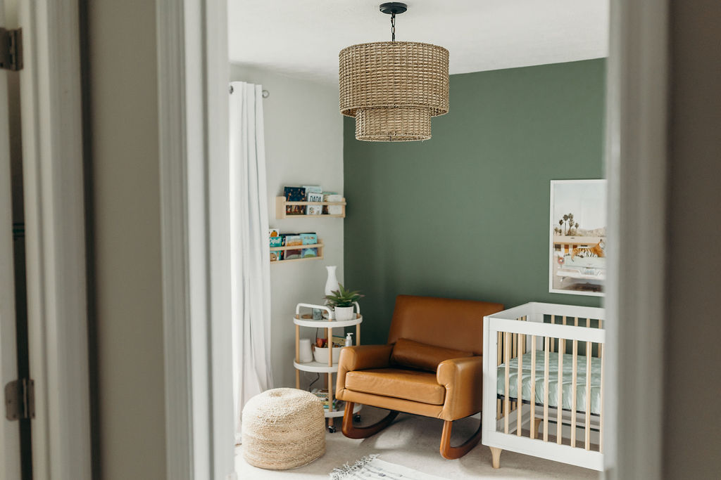 Baby boy nursery with green accent wall, gender neutral nursery