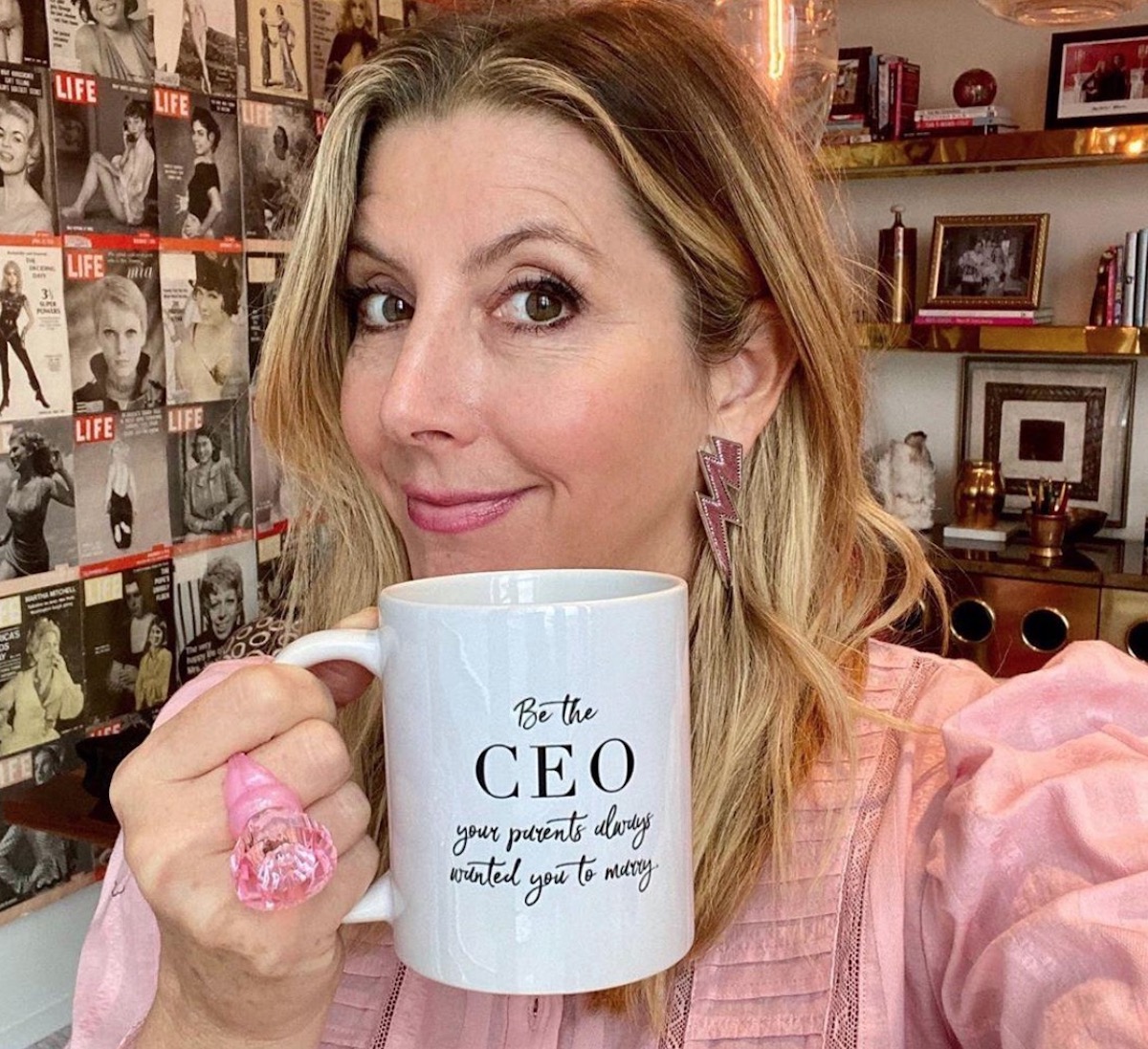 Screenshot Sara Blakely holding mug designed by Elizabeth McCravy